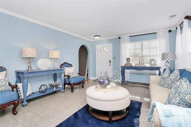 living room featuring crown molding