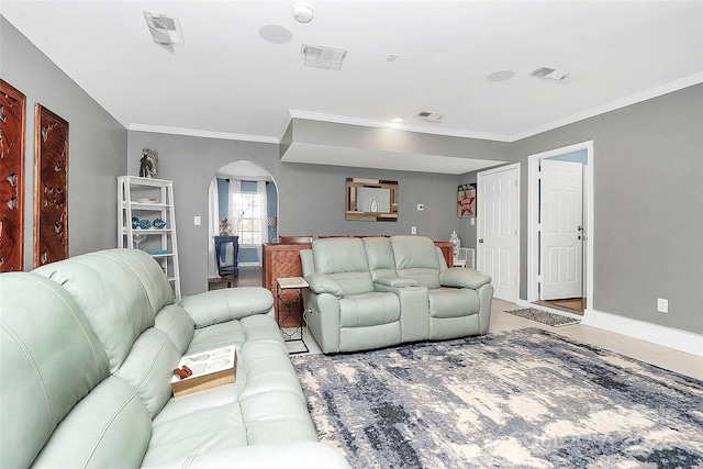 living room featuring ornamental molding and light tile patterned floors