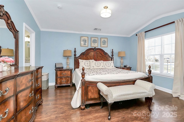 bedroom with dark wood-type flooring, crown molding, and vaulted ceiling