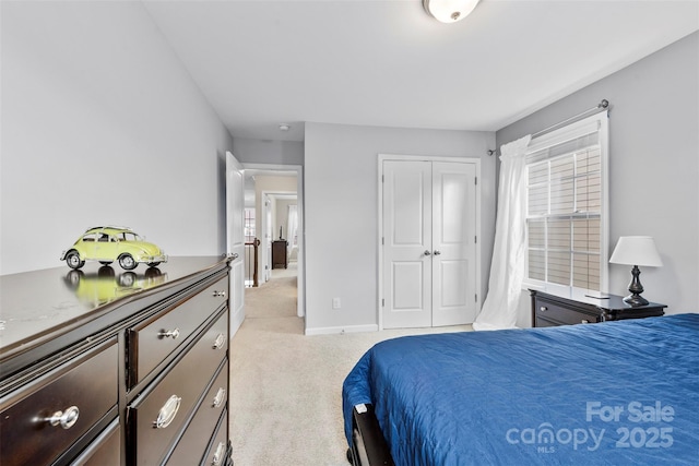 carpeted bedroom with a closet