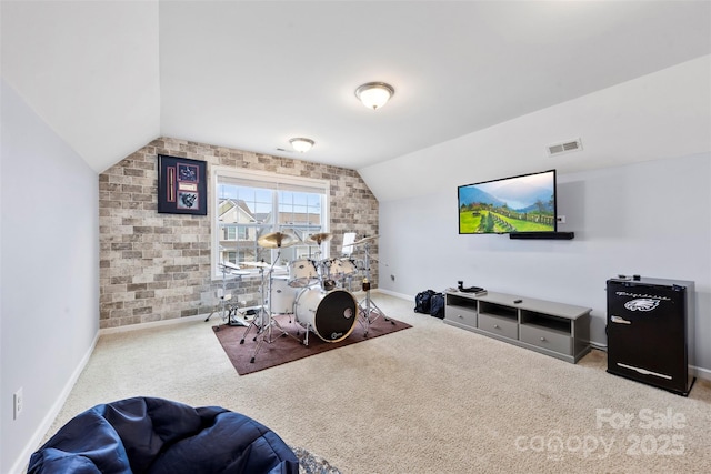 interior space featuring lofted ceiling, light colored carpet, and brick wall