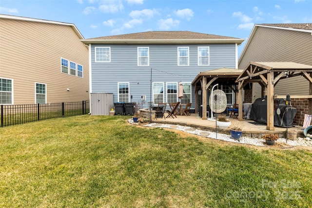 rear view of house featuring a yard, a gazebo, and a patio area