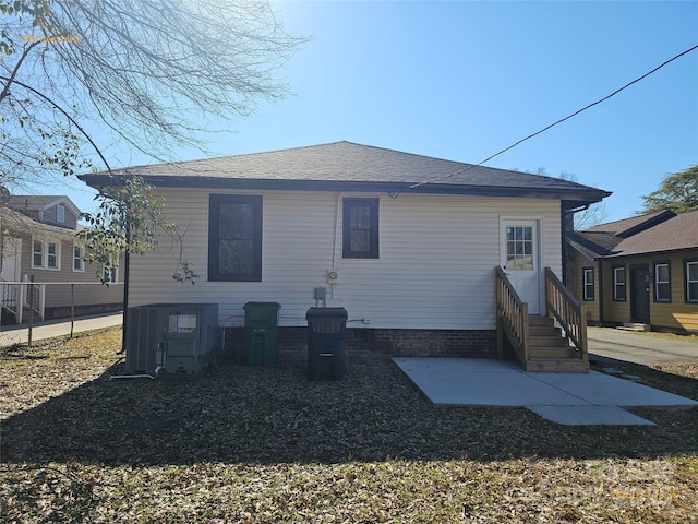 rear view of property with a patio area and central air condition unit