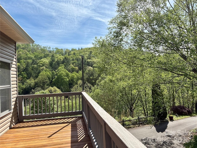 balcony featuring a view of trees