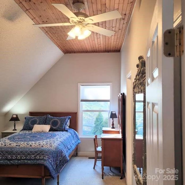 bedroom with carpet floors, lofted ceiling, baseboards, ceiling fan, and wood ceiling