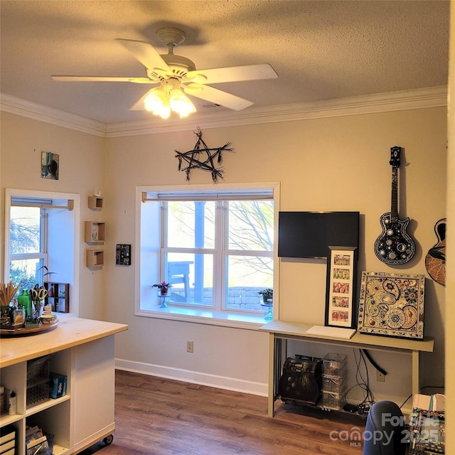 dining space featuring a ceiling fan, a textured ceiling, baseboards, dark wood-style floors, and ornamental molding