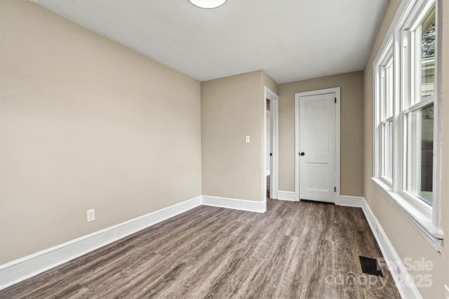 spare room featuring hardwood / wood-style flooring