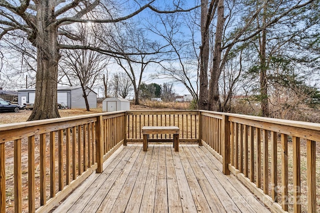 wooden deck with a storage shed