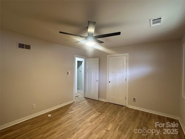 unfurnished bedroom featuring ceiling fan and light hardwood / wood-style flooring