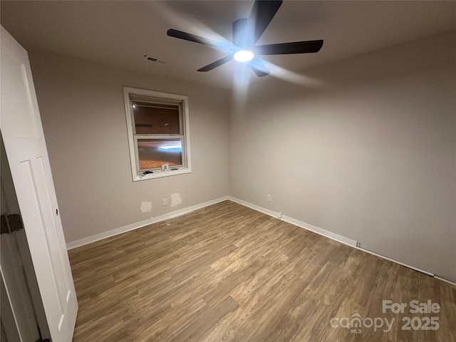 unfurnished room featuring wood-type flooring and ceiling fan