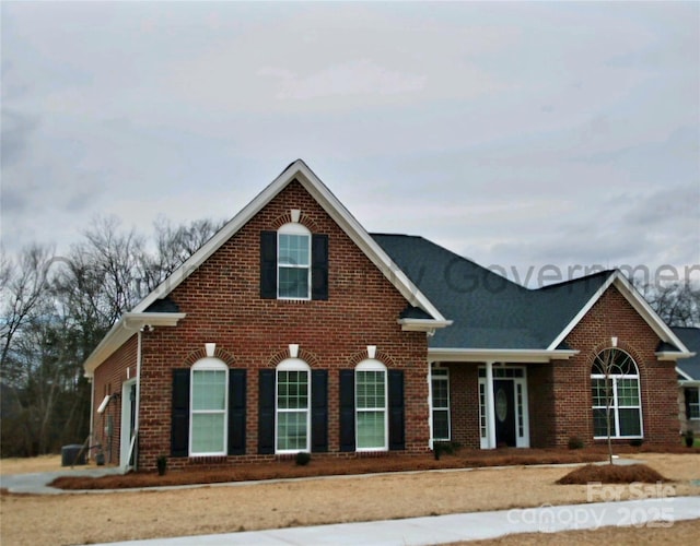 view of front of house with brick siding