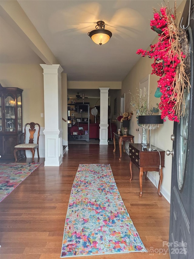 entrance foyer with wood-type flooring and decorative columns