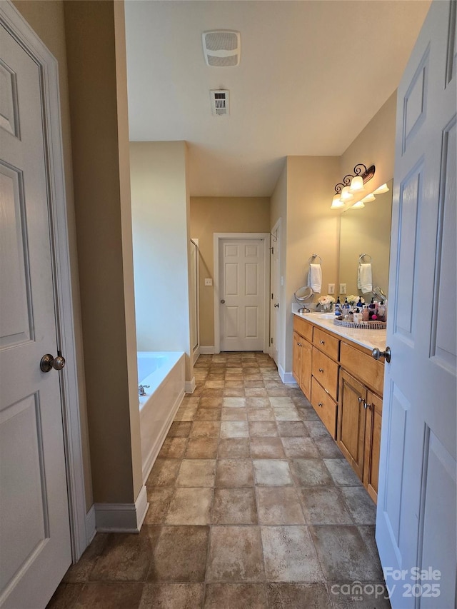 bathroom featuring vanity and plus walk in shower