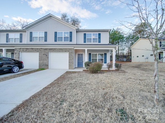 view of front property featuring a garage and covered porch