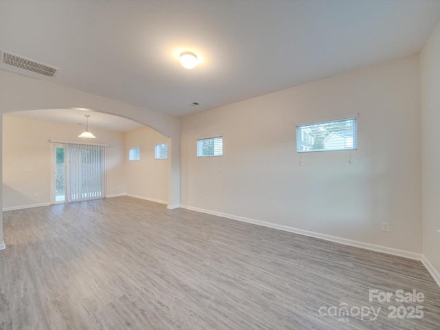 unfurnished room featuring wood-type flooring