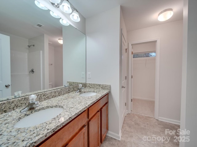 bathroom featuring vanity and walk in shower