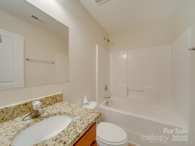 full bathroom featuring vanity, shower / washtub combination, and toilet