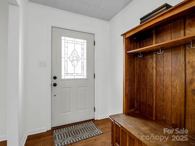 mudroom with dark wood-type flooring and ornamental molding