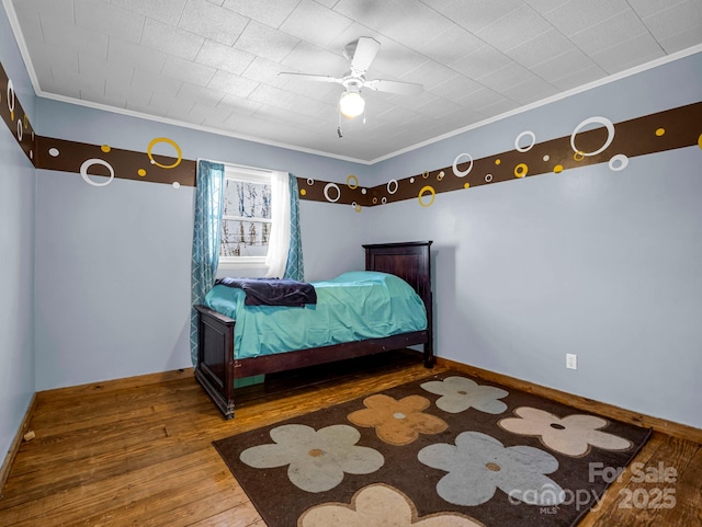 bedroom with hardwood / wood-style floors and ceiling fan