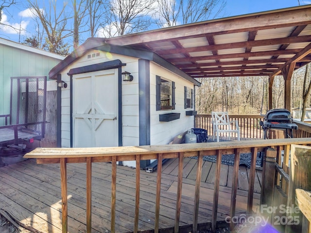 wooden deck with a storage shed