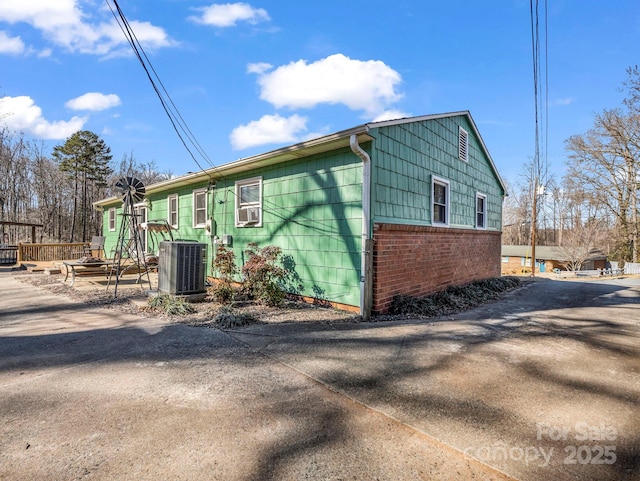 view of property exterior featuring central AC