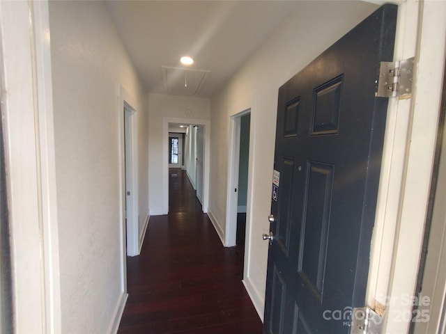 hall with dark hardwood / wood-style flooring