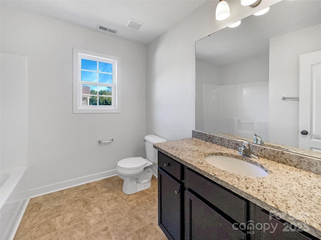 bathroom featuring vanity and toilet