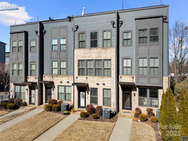 view of building exterior with cooling unit