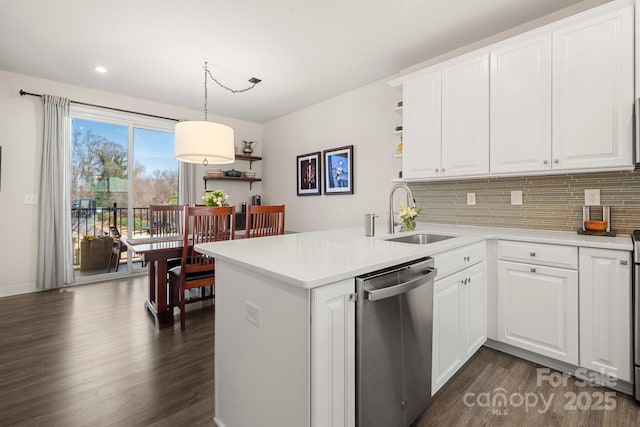 kitchen with white cabinetry, kitchen peninsula, sink, and dishwasher