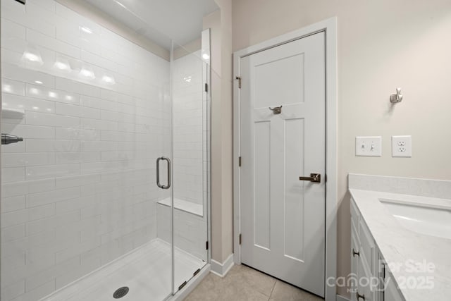 bathroom with vanity, an enclosed shower, and tile patterned floors