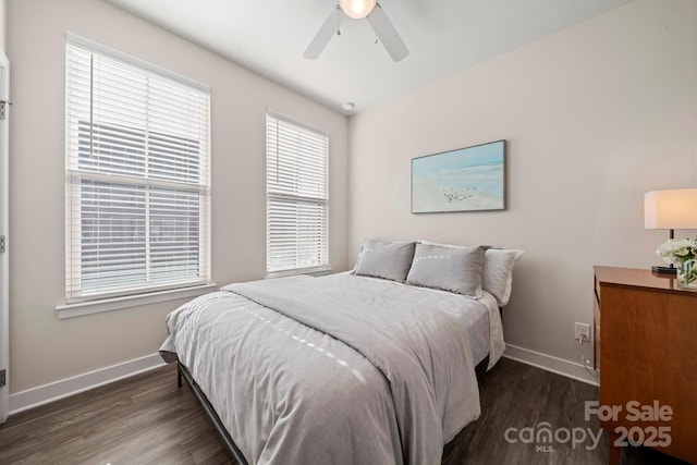 bedroom with dark wood-type flooring and ceiling fan