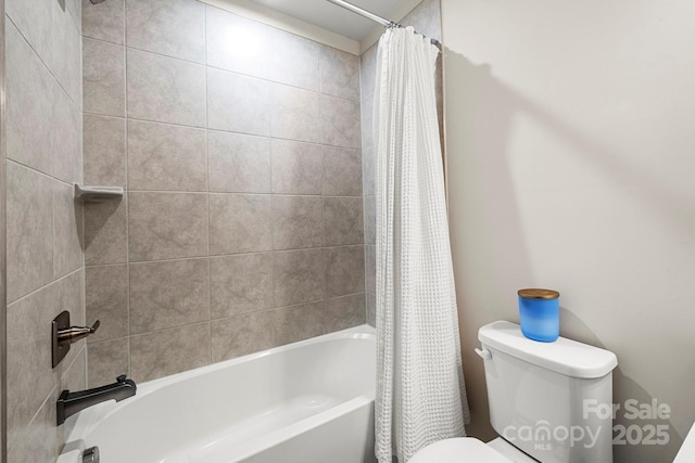 bathroom featuring shower / bathtub combination with curtain and toilet