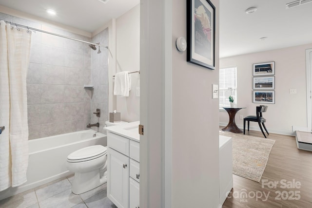 full bathroom featuring tile patterned floors, vanity, toilet, and shower / bath combo with shower curtain