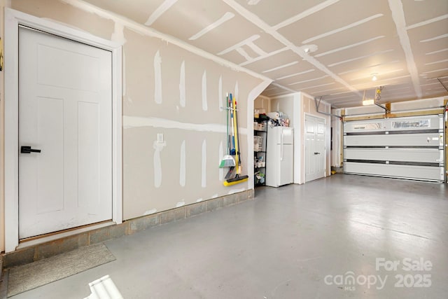 garage featuring white refrigerator