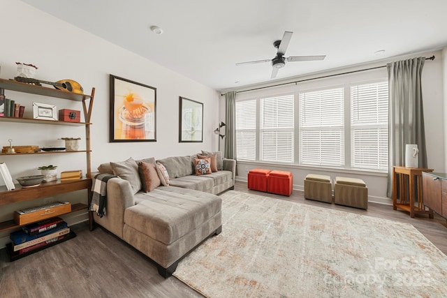 living room featuring hardwood / wood-style floors and ceiling fan