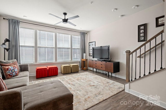 living room featuring hardwood / wood-style flooring and ceiling fan