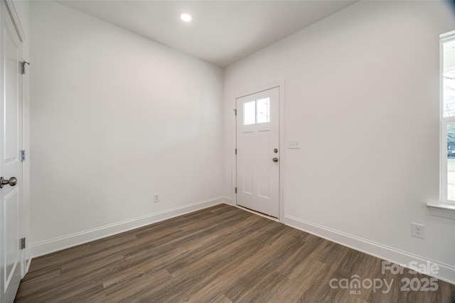 foyer entrance with dark hardwood / wood-style floors