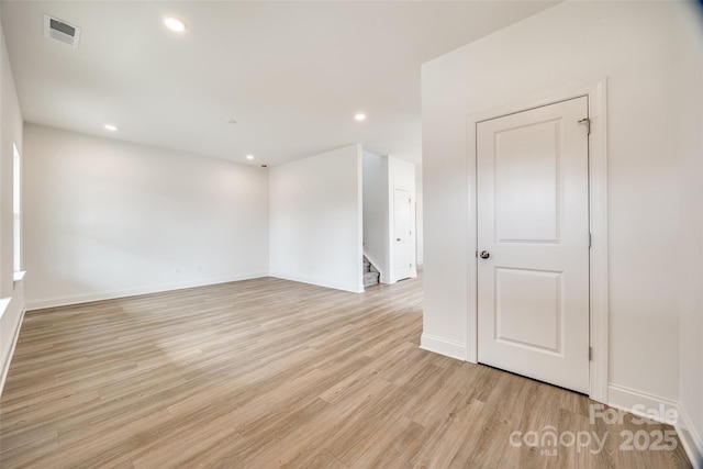 spare room featuring light hardwood / wood-style flooring