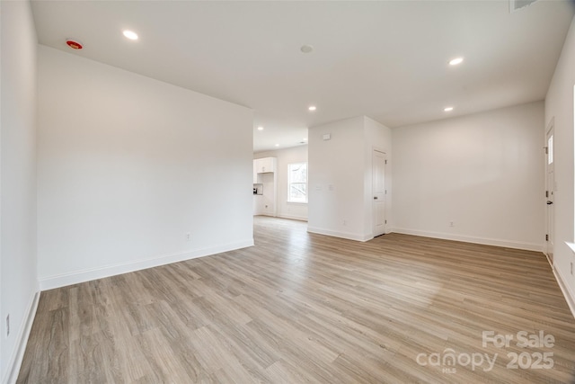 spare room with light wood-type flooring