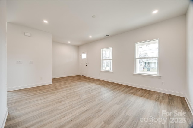 unfurnished room featuring light hardwood / wood-style floors