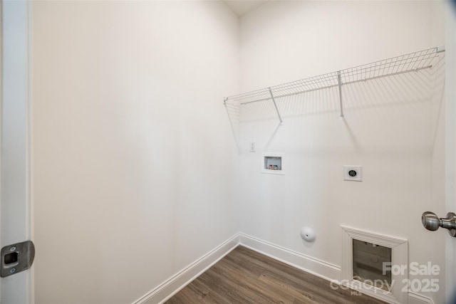 clothes washing area with dark wood-type flooring, hookup for an electric dryer, hookup for a gas dryer, and hookup for a washing machine