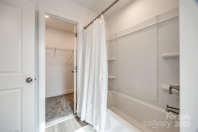 bathroom featuring shower / bath combination with curtain