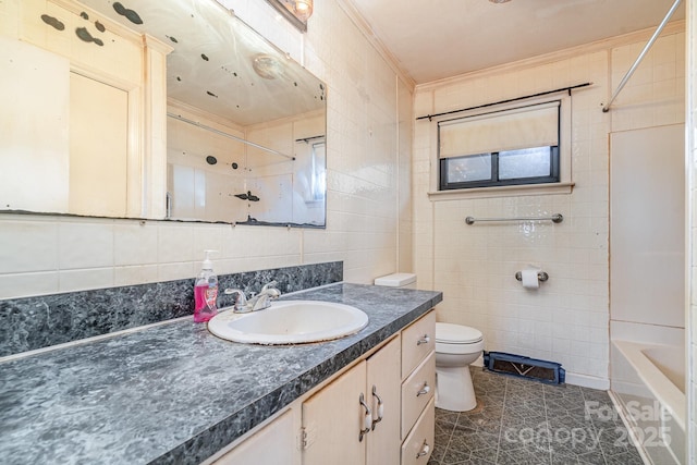 full bath with toilet, tile walls, and vanity