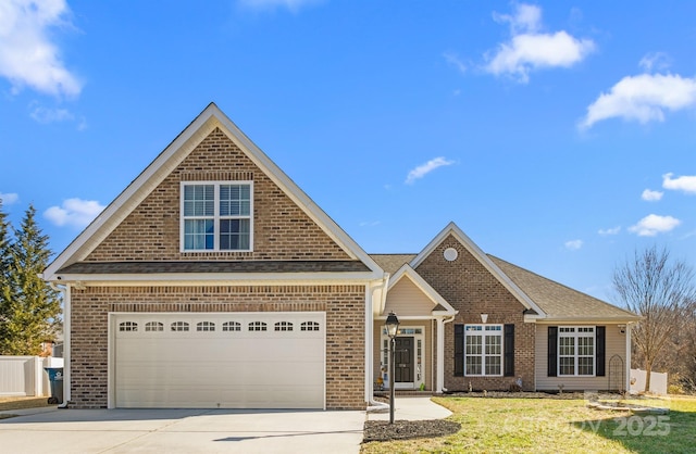 view of front of property featuring a garage and a front lawn