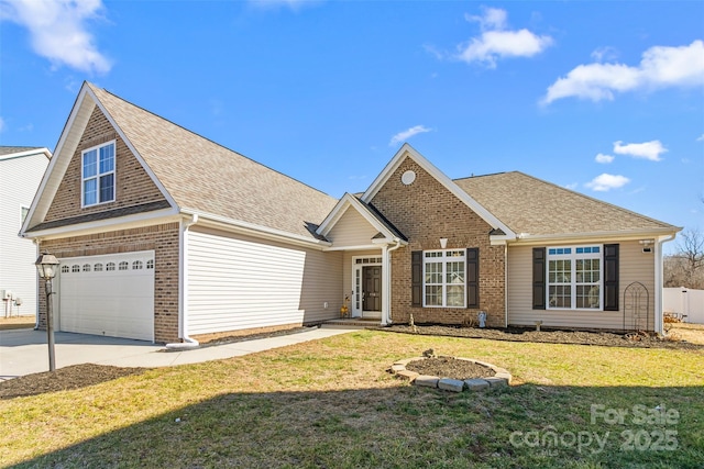 view of front of property featuring a garage and a front lawn