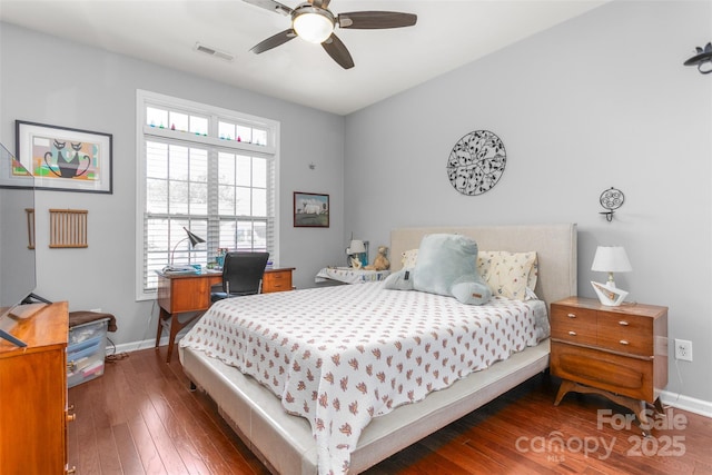 bedroom with ceiling fan and dark hardwood / wood-style floors