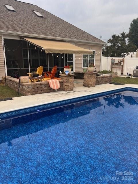 view of swimming pool featuring a fire pit and a patio area