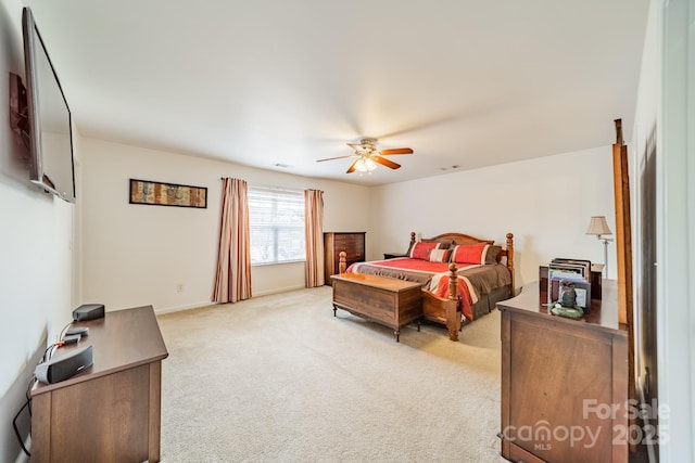 bedroom featuring ceiling fan and light carpet