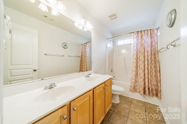 full bathroom with vanity, shower / tub combo with curtain, tile patterned floors, and toilet