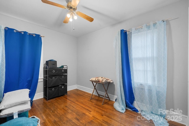 miscellaneous room with dark wood-type flooring and ceiling fan